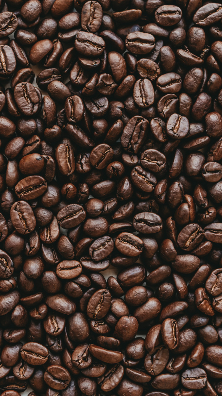 Coffee Beans on Brown Wooden Surface. Wallpaper in 750x1334 Resolution