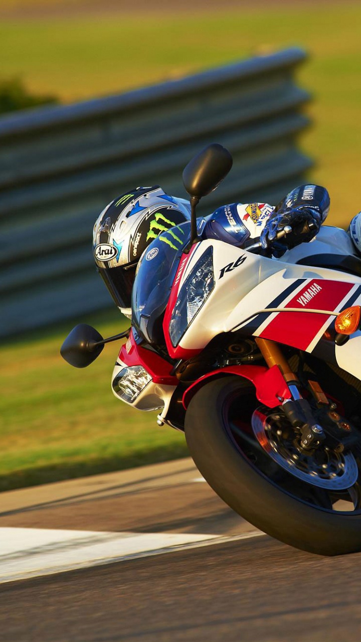 Man Riding on Red and White Sports Bike. Wallpaper in 720x1280 Resolution