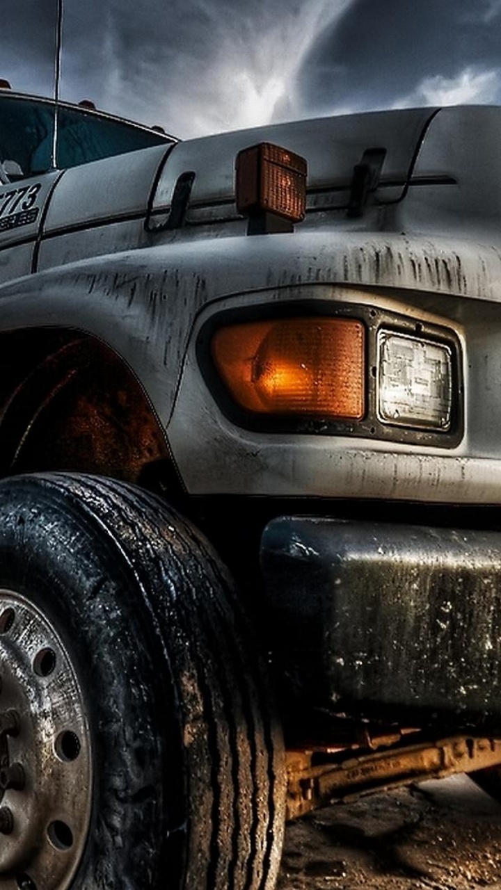 Grey Truck on Grey Dirt Road During Daytime. Wallpaper in 720x1280 Resolution