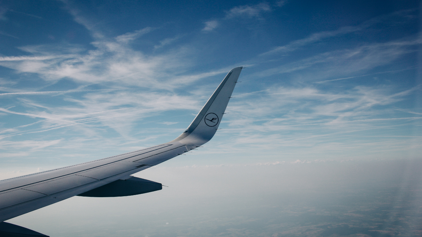White Airplane Wing Under Blue Sky and White Clouds During Daytime. Wallpaper in 1366x768 Resolution