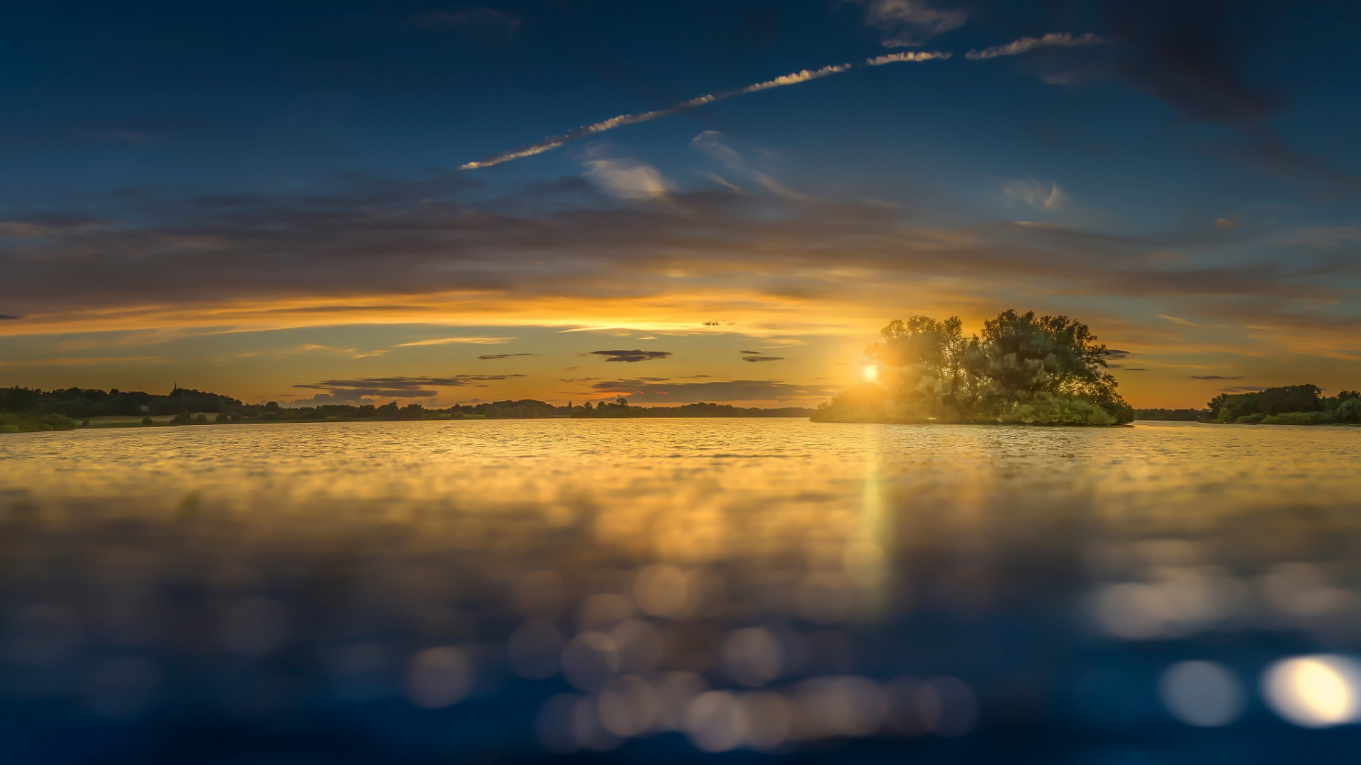 Green Trees Near Body of Water During Sunset. Wallpaper in 1920x1080 Resolution