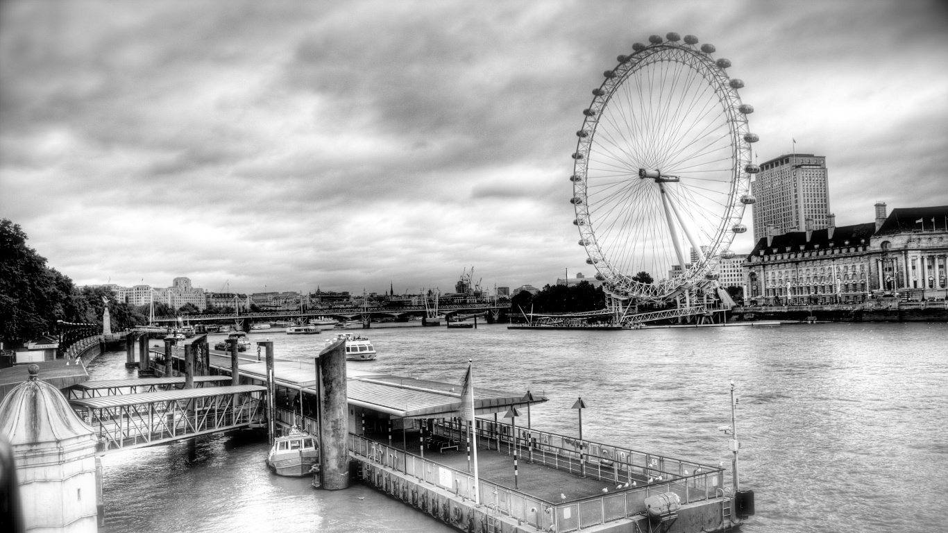 Grayscale Photo of Ferris Wheel Near Body of Water. Wallpaper in 1366x768 Resolution