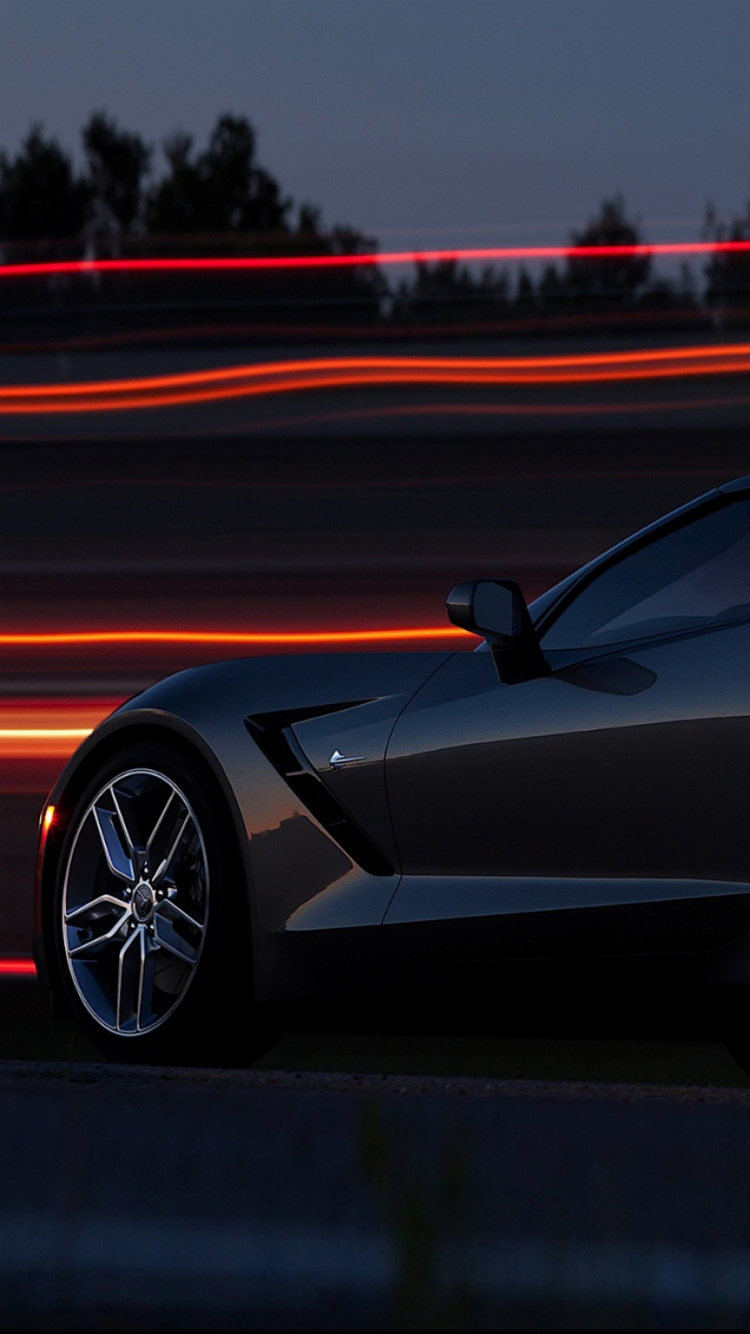 Schwarzer Porsche 911 Tagsüber Unterwegs. Wallpaper in 750x1334 Resolution