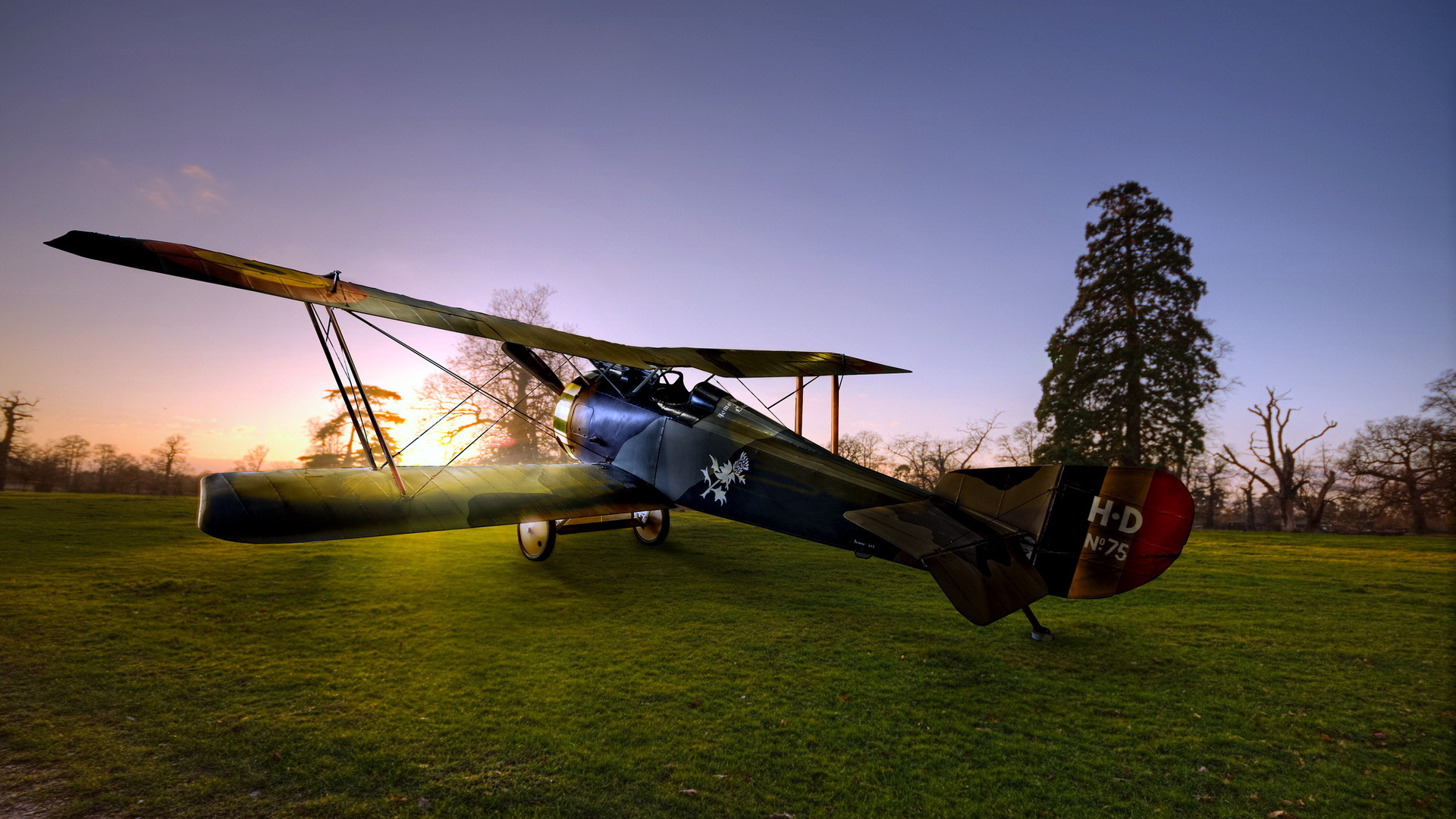 Black and Brown Helicopter on Green Grass Field Under Blue Sky During Daytime. Wallpaper in 1920x1080 Resolution