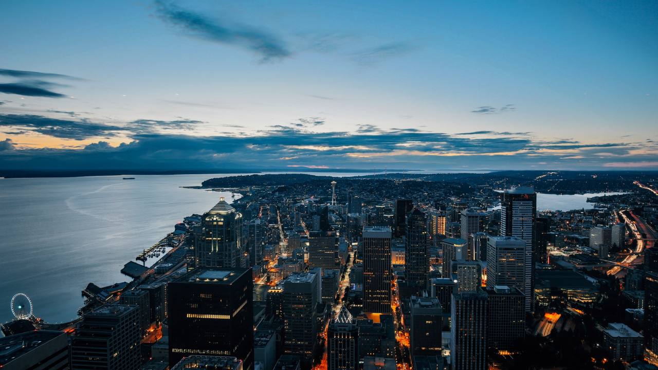 City Skyline Near Body of Water During Night Time. Wallpaper in 1280x720 Resolution