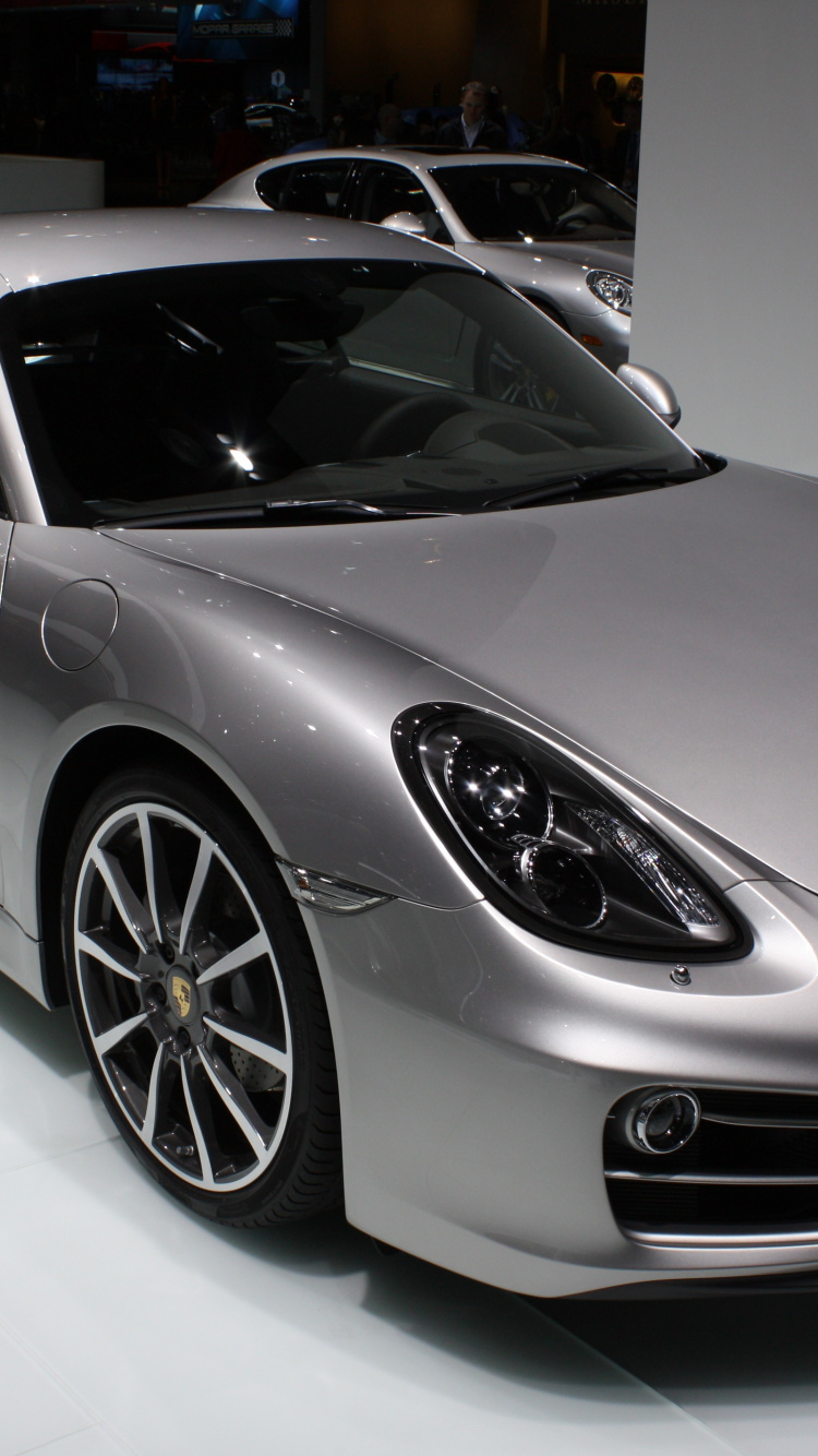 Silver Porsche 911 Parked in a Room. Wallpaper in 750x1334 Resolution