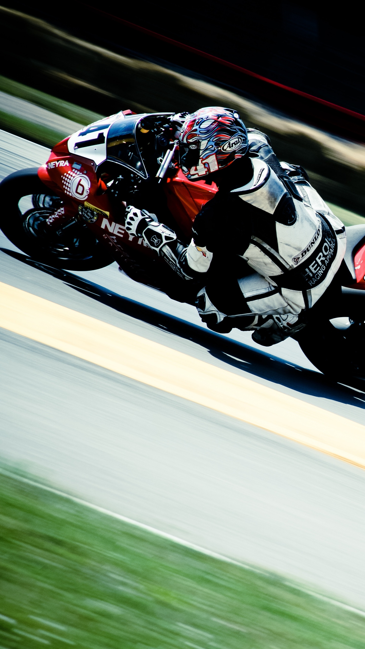 Man in Red and White Racing Suit Riding on Sports Bike. Wallpaper in 1440x2560 Resolution