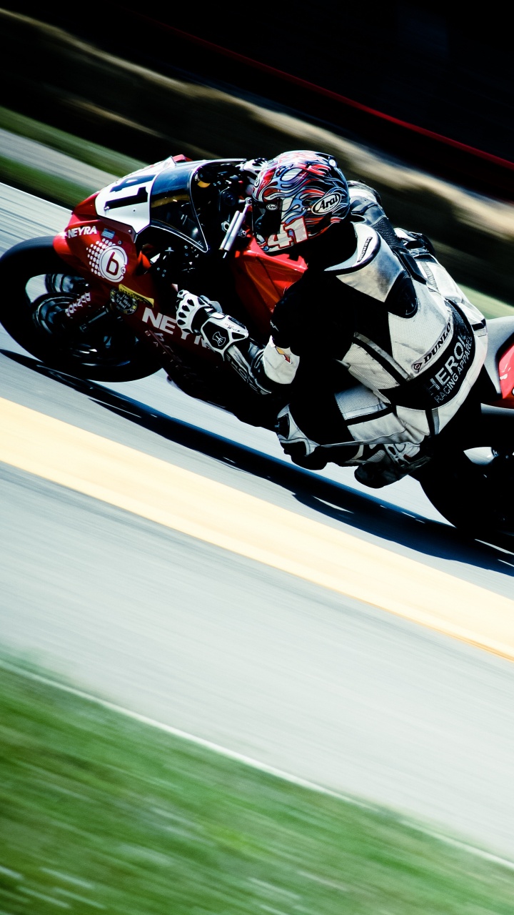 Man in Red and White Racing Suit Riding on Sports Bike. Wallpaper in 720x1280 Resolution