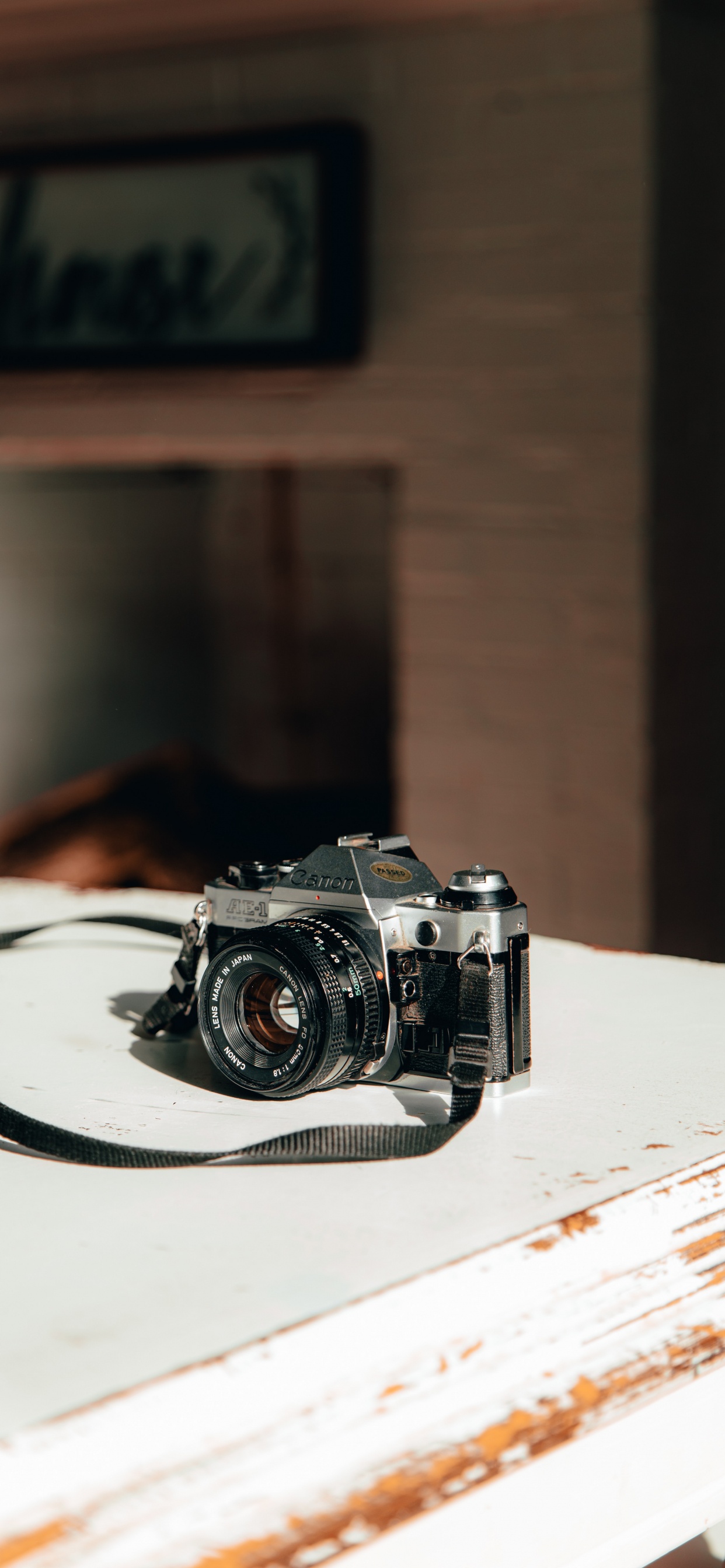 Black and Silver Camera on White Table. Wallpaper in 1242x2688 Resolution
