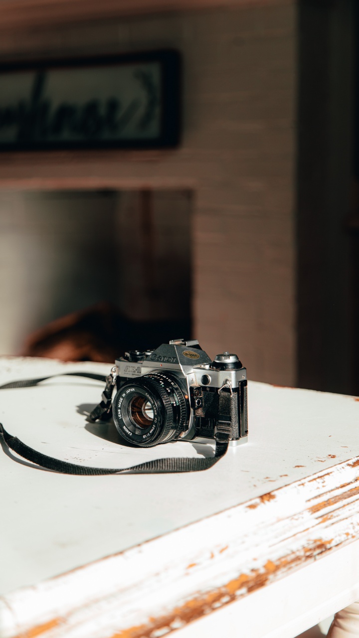 Black and Silver Camera on White Table. Wallpaper in 720x1280 Resolution