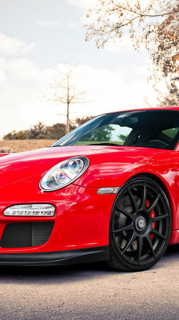 Porsche 911 Rojo Estacionado en la Carretera Durante el Día. Wallpaper in 750x1334 Resolution