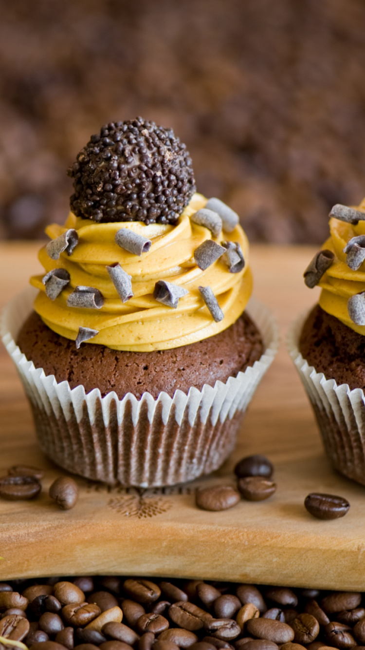 3 Cupcakes on Brown Wooden Table. Wallpaper in 750x1334 Resolution