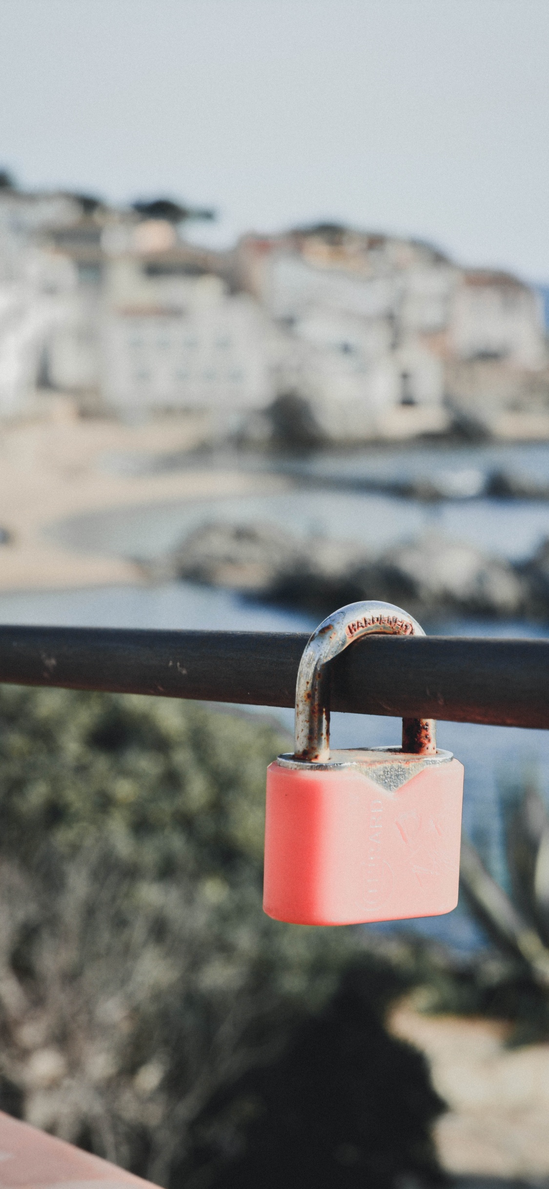 Pink Padlock on Brown Metal Fence During Daytime. Wallpaper in 1125x2436 Resolution