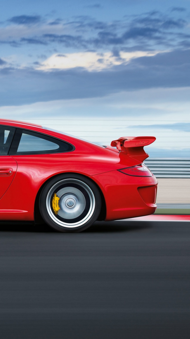 Red Coupe on Gray Asphalt Road During Daytime. Wallpaper in 720x1280 Resolution