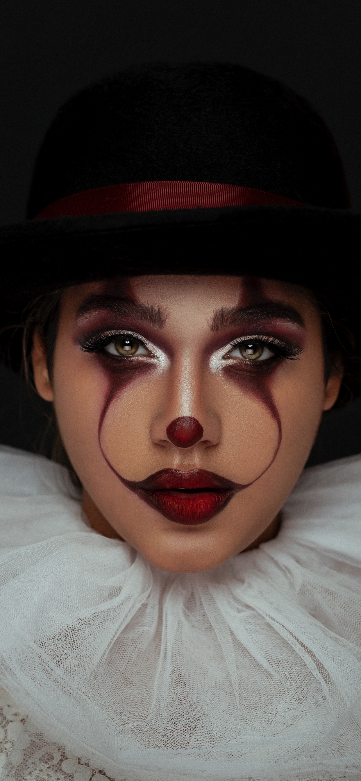 Woman in Black Hat and White Shirt. Wallpaper in 1242x2688 Resolution