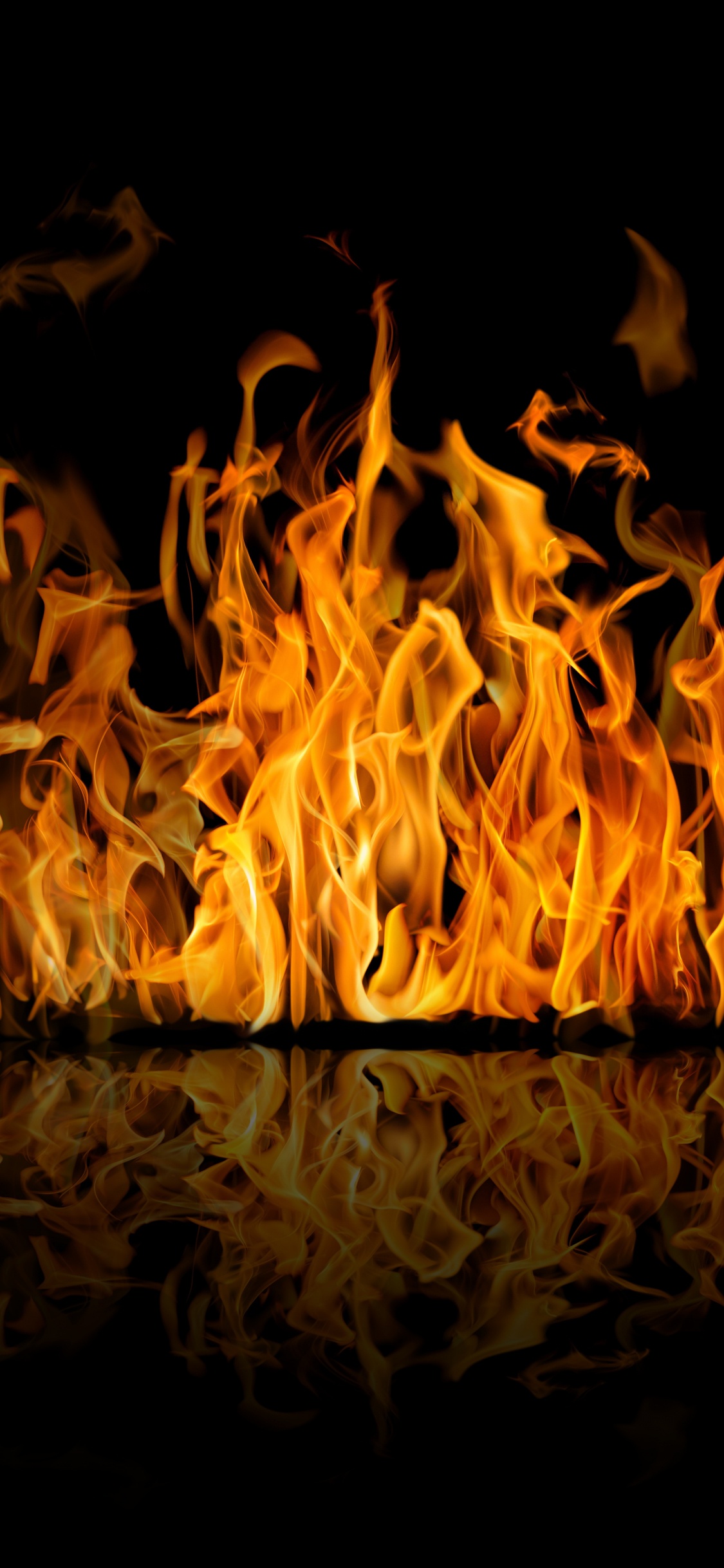 Fire in Black Background With Black Background. Wallpaper in 1125x2436 Resolution