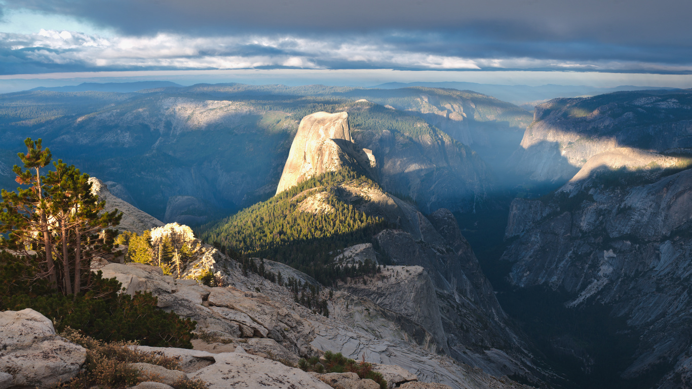 Green and Brown Mountain Under White Clouds During Daytime. Wallpaper in 1366x768 Resolution
