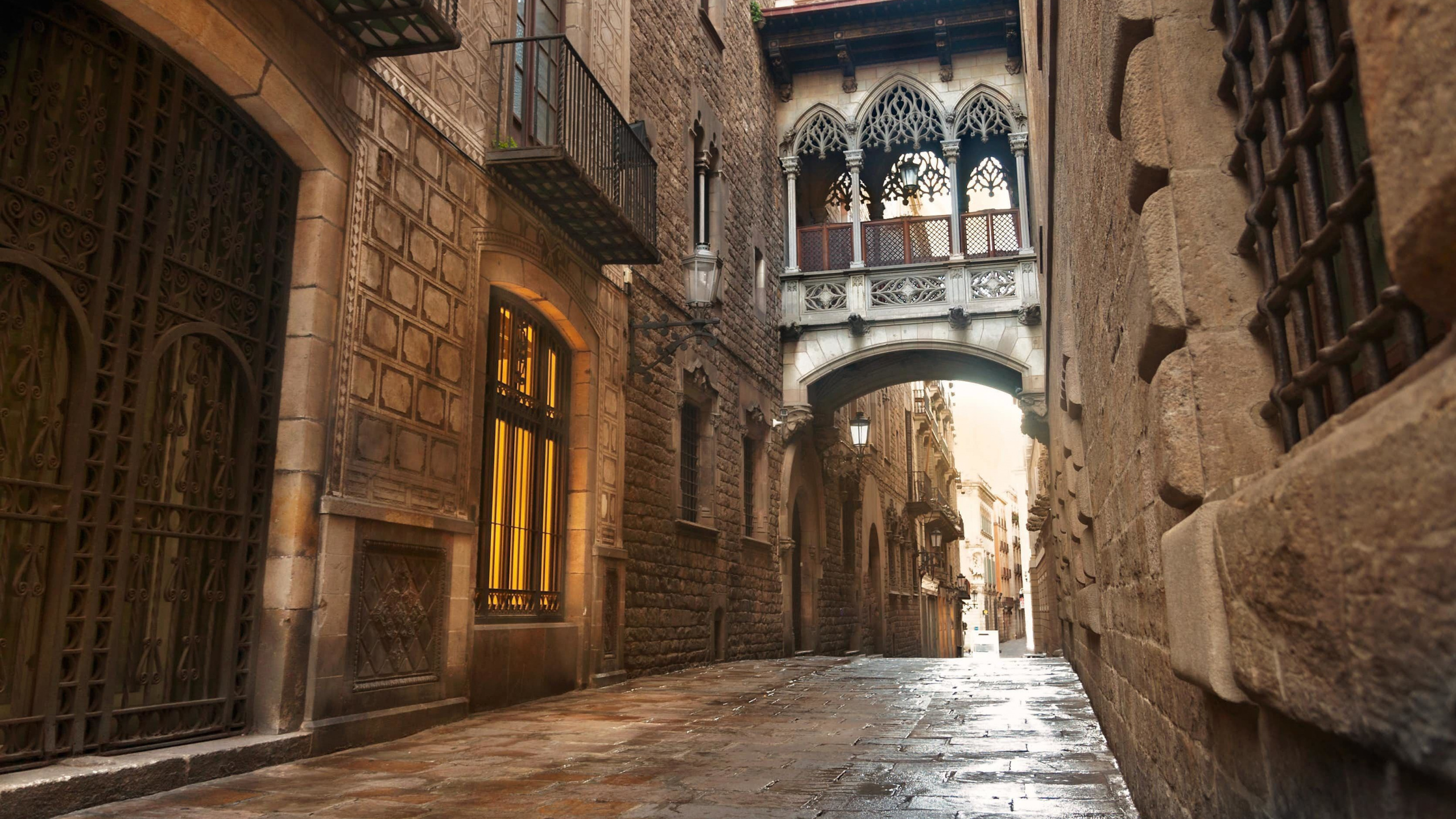 Brown Brick Building With Arch Shaped Windows. Wallpaper in 2560x1440 Resolution