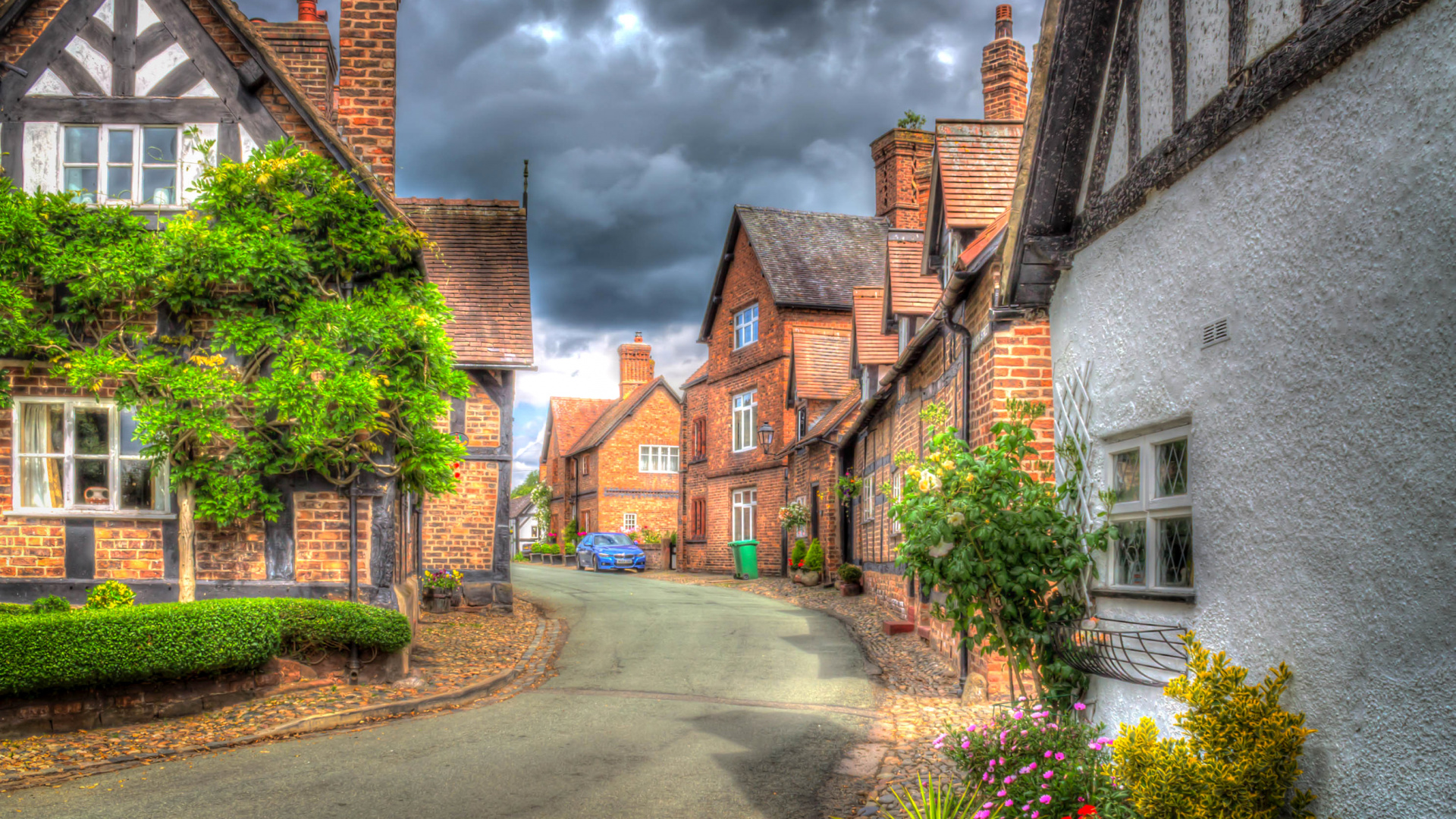 Brown Brick Houses Near Green Trees Under Cloudy Sky During Daytime. Wallpaper in 1920x1080 Resolution