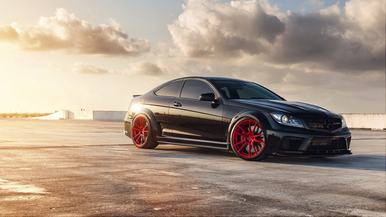 Black Coupe on Brown Field Under White Clouds During Daytime. Wallpaper in 1280x720 Resolution