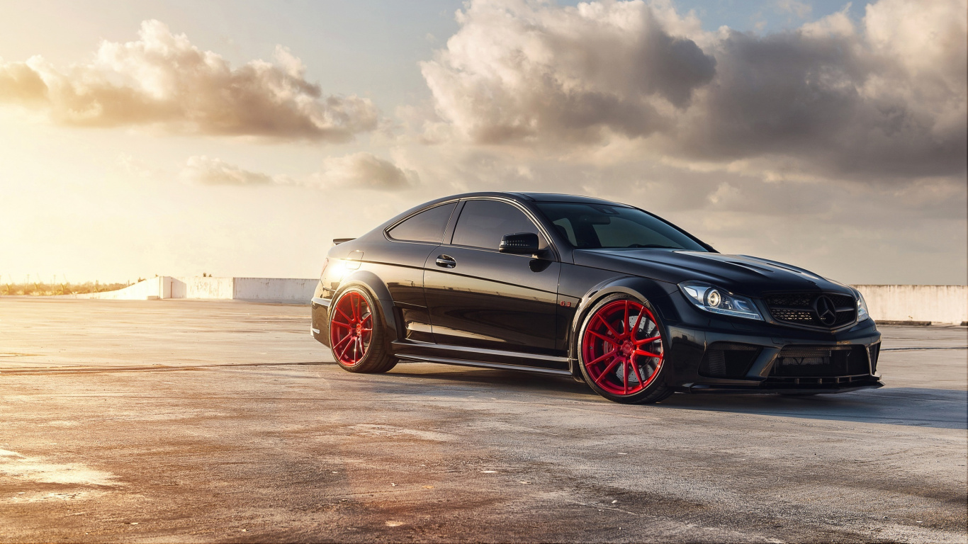Black Coupe on Brown Field Under White Clouds During Daytime. Wallpaper in 1366x768 Resolution