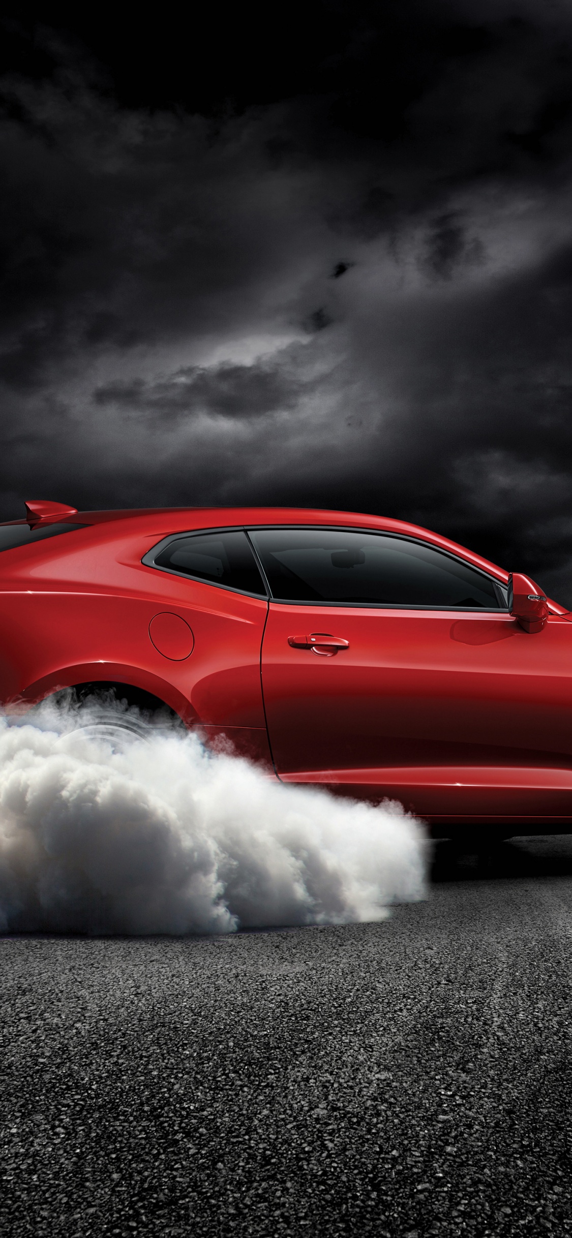 Red Chevrolet Camaro on Gray Asphalt Road. Wallpaper in 1125x2436 Resolution