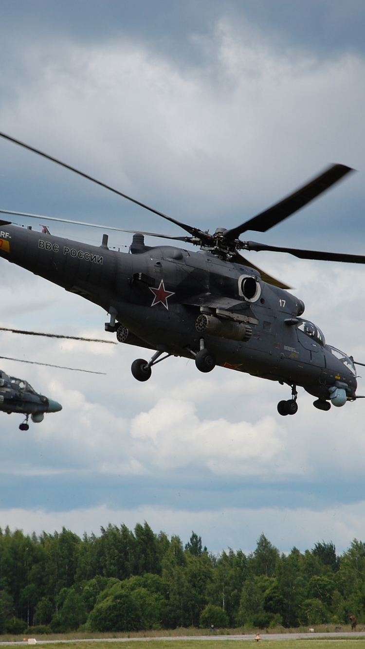 Black and Gray Fighter Plane Flying Over Green Trees During Daytime. Wallpaper in 750x1334 Resolution