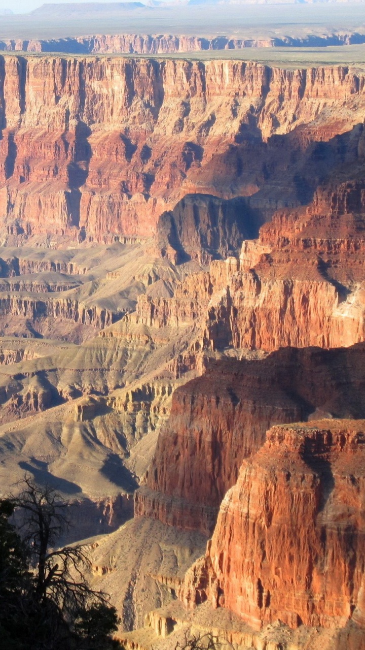 Brown Rocky Mountain Under Blue Sky During Daytime. Wallpaper in 720x1280 Resolution