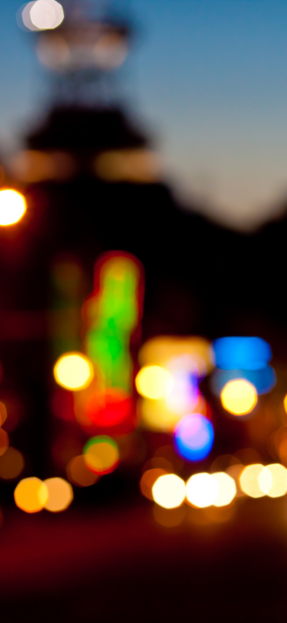 Photographie Bokeh Des Lumières de la Ville Pendant la Nuit. Wallpaper in 1125x2436 Resolution