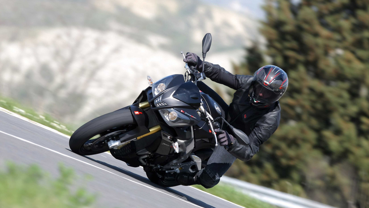 Man in Black Jacket Riding Black Sports Bike. Wallpaper in 1280x720 Resolution