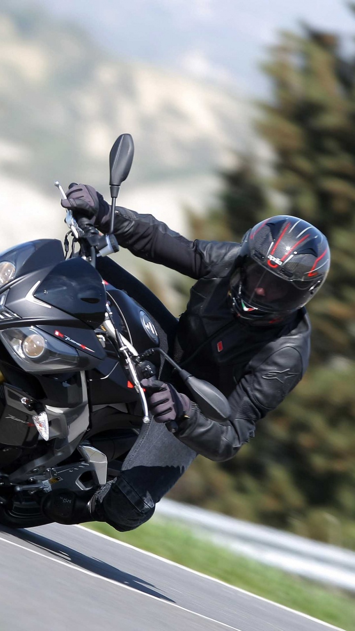 Man in Black Jacket Riding Black Sports Bike. Wallpaper in 720x1280 Resolution