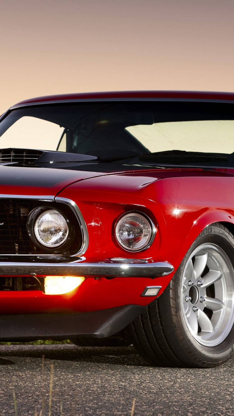 Roter Chevrolet Camaro Auf Grauem Hintergrund. Wallpaper in 750x1334 Resolution