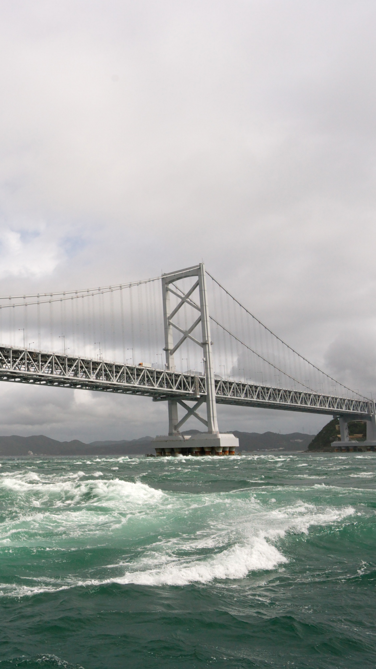Gray Bridge Over The Sea During Daytime. Wallpaper in 1440x2560 Resolution