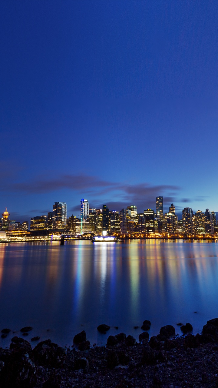 City Skyline During Night Time. Wallpaper in 720x1280 Resolution