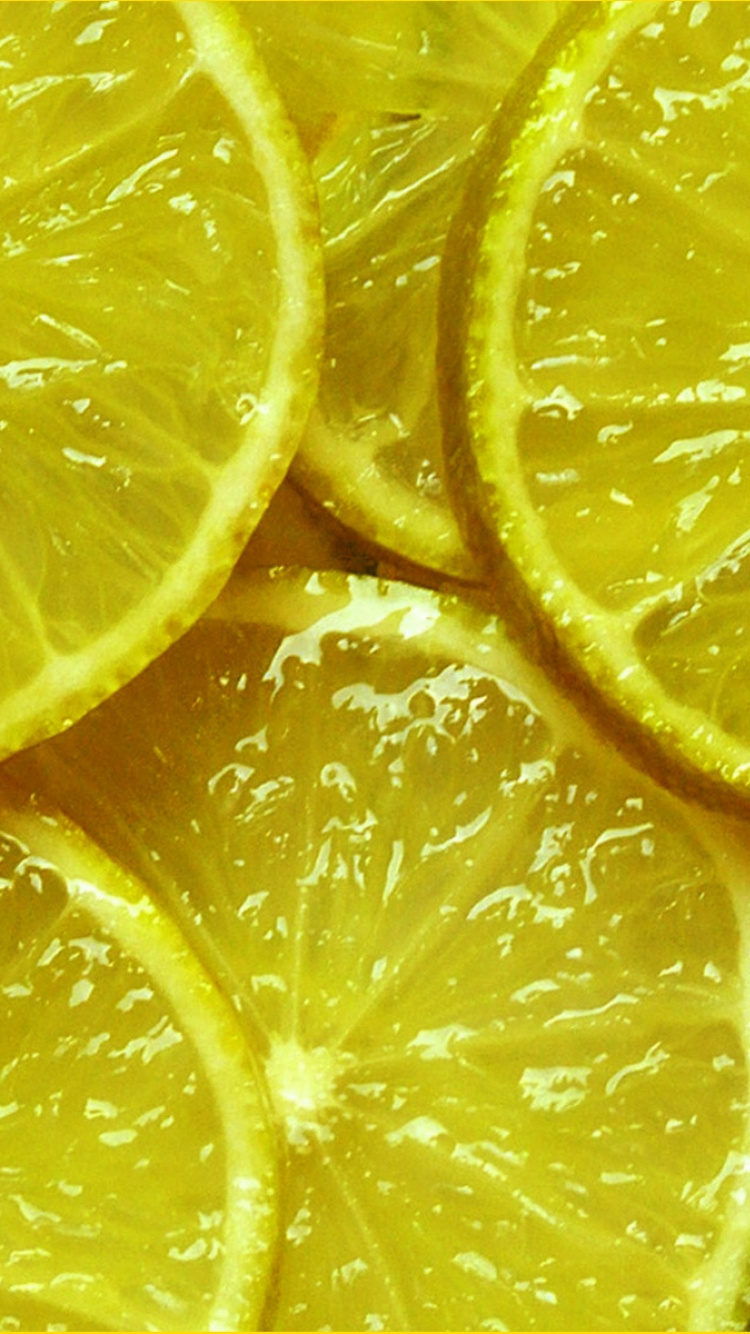 Close up Photo of Sliced Lemon. Wallpaper in 750x1334 Resolution
