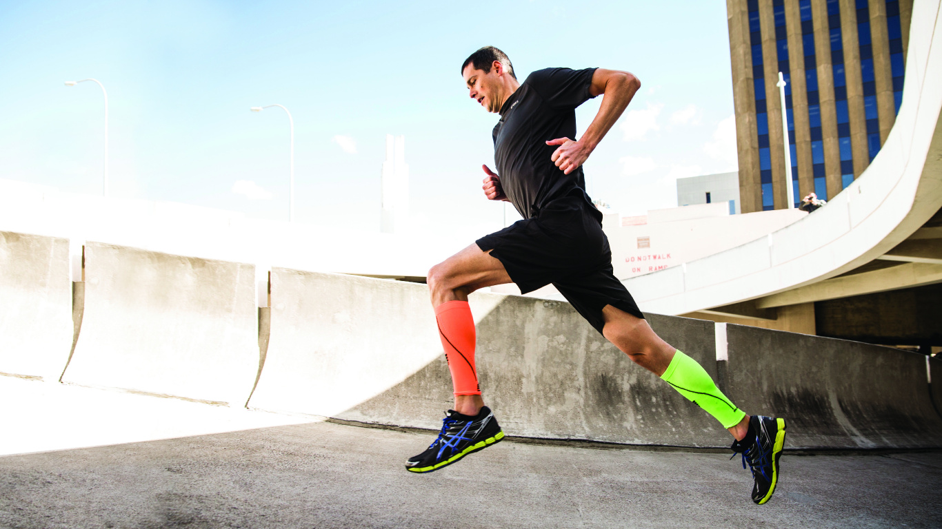 Man in Black T-shirt and Black Shorts Running on Gray Concrete Road During Daytime. Wallpaper in 1366x768 Resolution