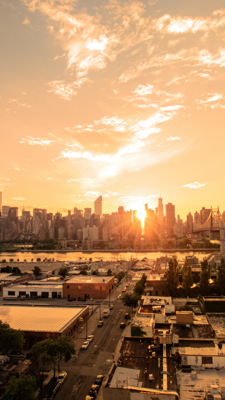 City With High Rise Buildings Under Blue Sky During Daytime. Wallpaper in 750x1334 Resolution