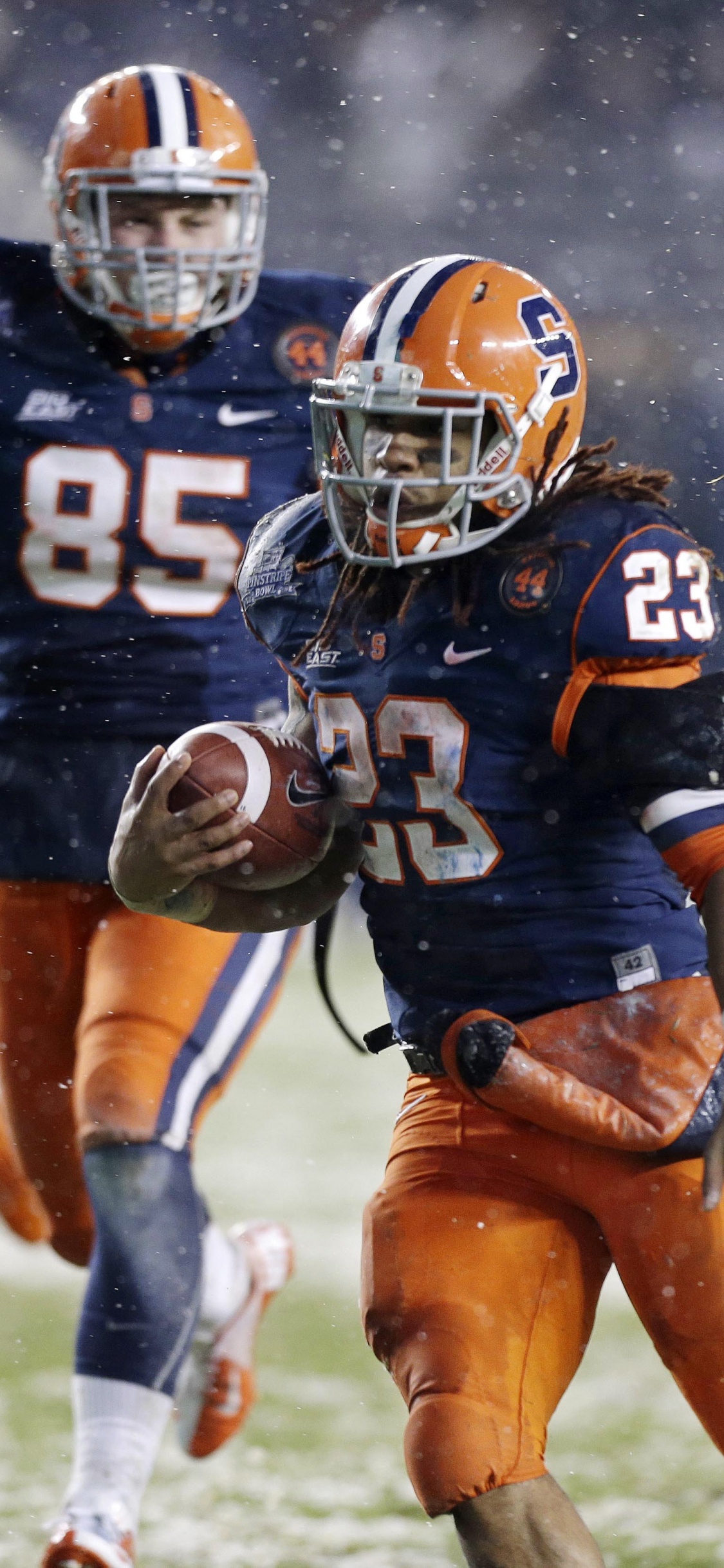 Football Player in Blue Jersey Shirt and Shorts. Wallpaper in 1125x2436 Resolution