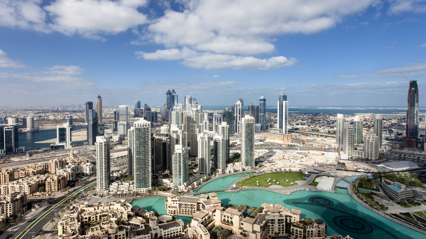 City Skyline Under Blue and White Sunny Cloudy Sky During Daytime. Wallpaper in 1366x768 Resolution