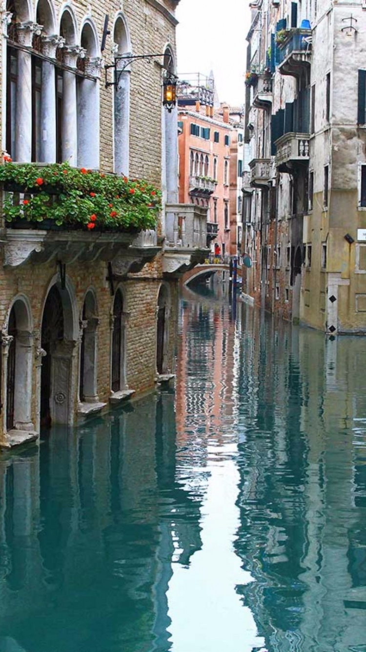 River Between Concrete Buildings During Daytime. Wallpaper in 750x1334 Resolution