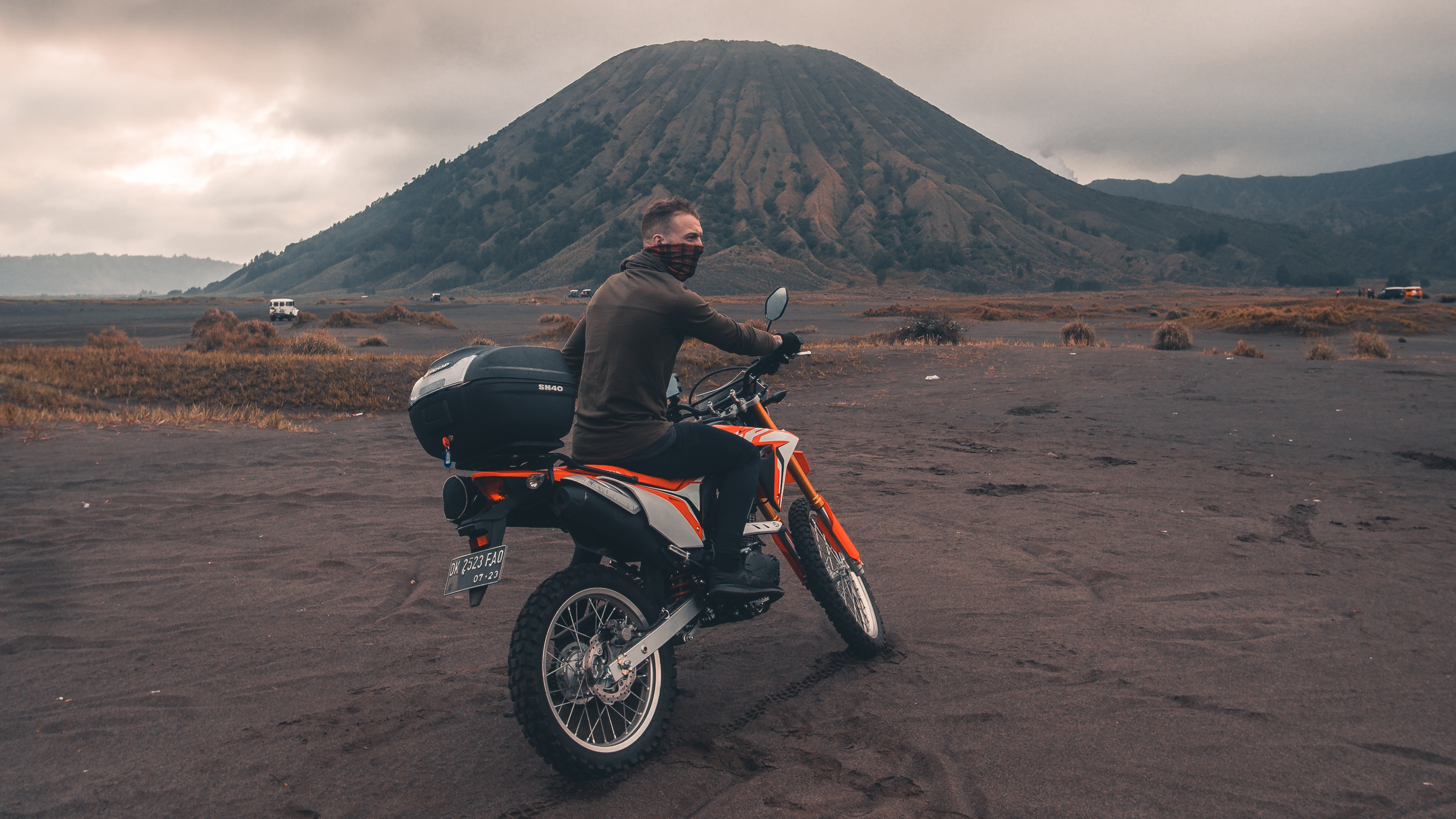 Red and Black Motorcycle on Brown Sand Under Cloudy Sky During Daytime. Wallpaper in 3840x2160 Resolution