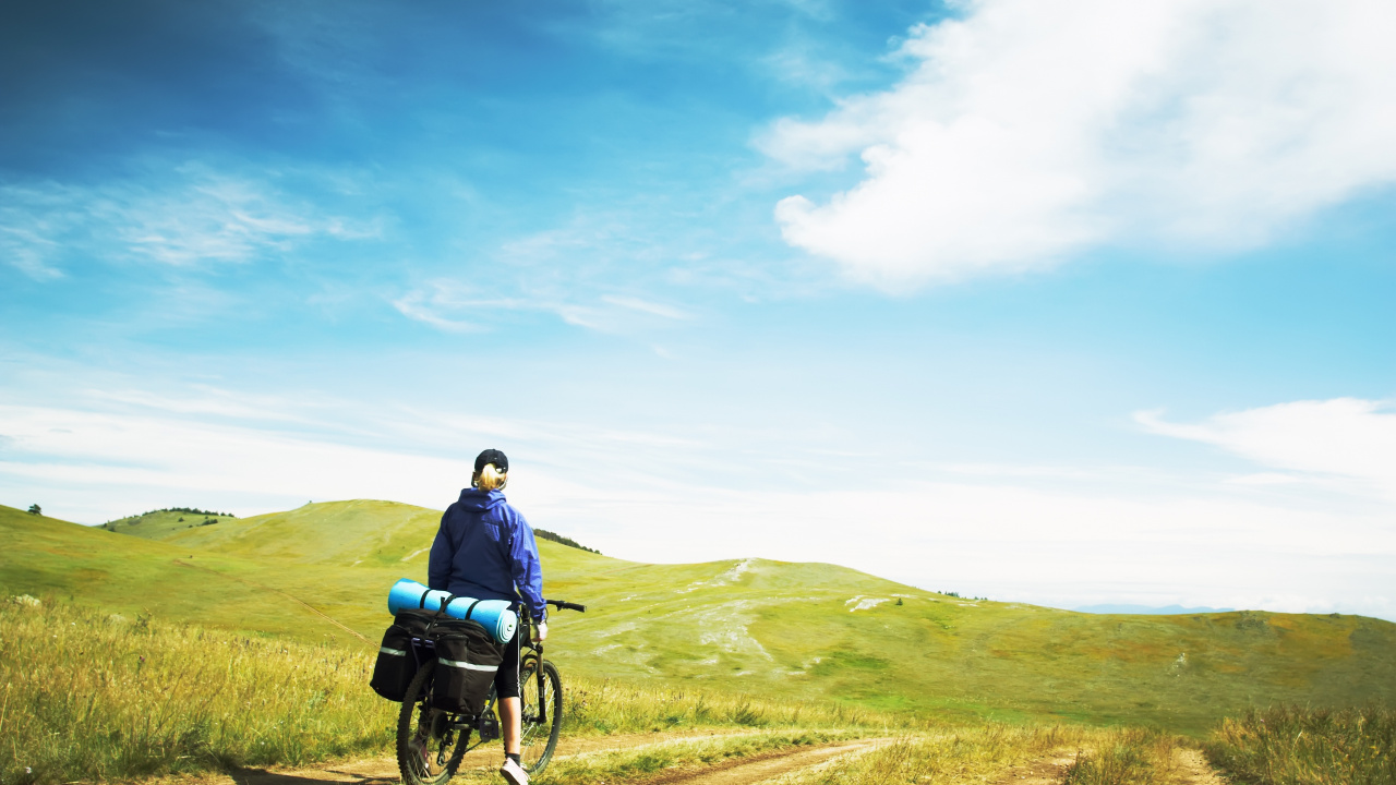 Man in Blue Jacket and Black Pants Sitting on Black Wheelchair on Green Grass Field During. Wallpaper in 1280x720 Resolution