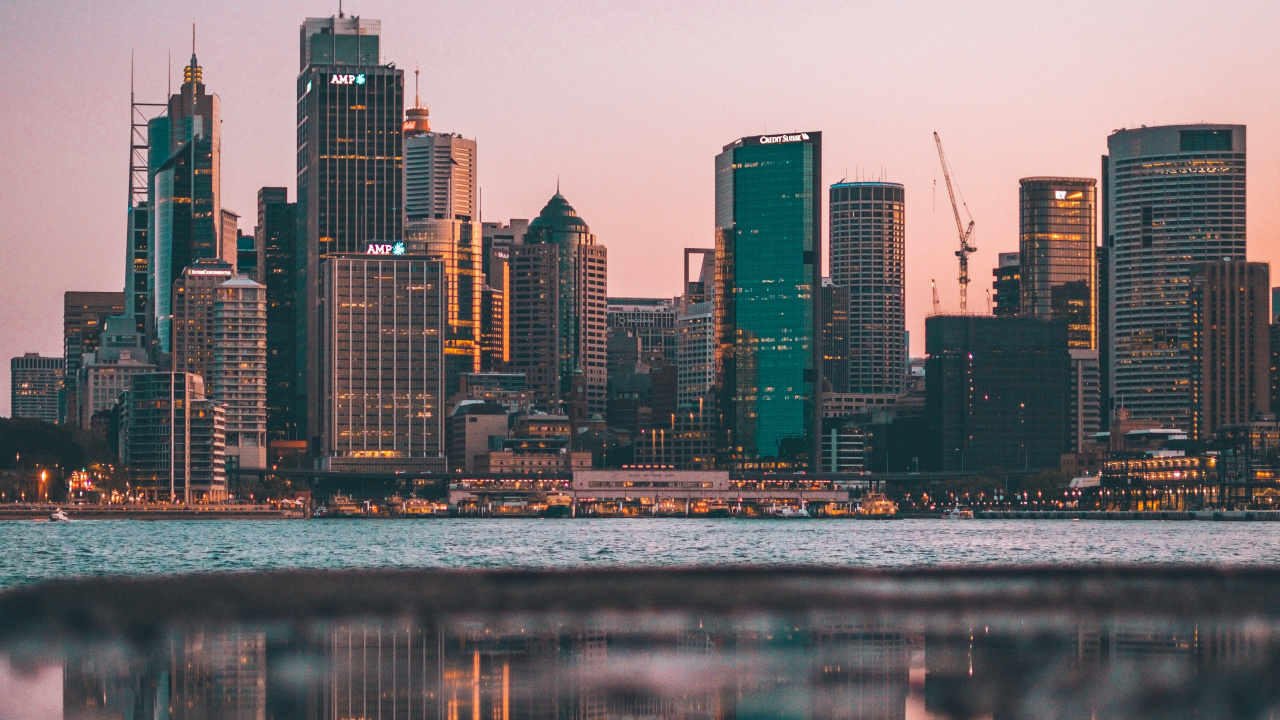 City Skyline Across Body of Water During Night Time. Wallpaper in 1280x720 Resolution