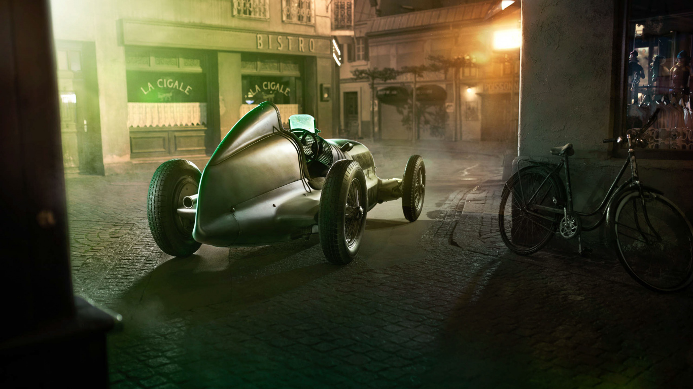 Green and Black Motorcycle Parked Beside Building During Night Time. Wallpaper in 1366x768 Resolution