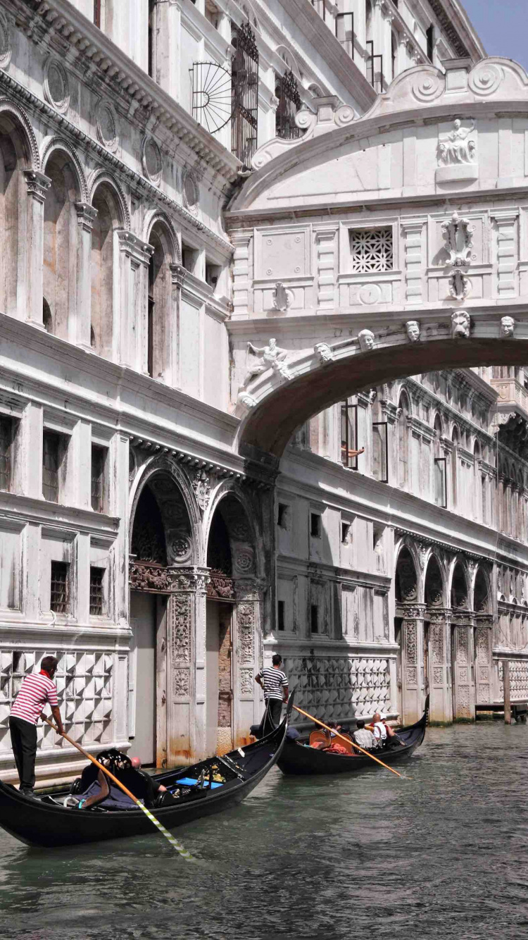 People Riding on Boat on River Near White Concrete Building During Daytime. Wallpaper in 750x1334 Resolution