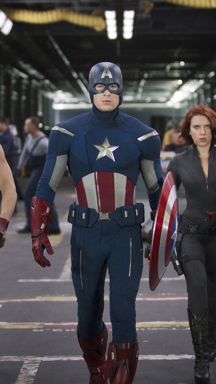 Man in Black and Red Captain America Costume Standing Beside Man in Black and Red Jersey. Wallpaper in 720x1280 Resolution