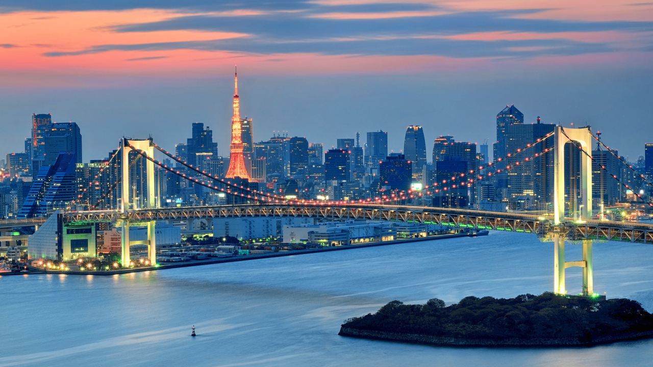 Bridge Over Water Near City Skyline During Night Time. Wallpaper in 1280x720 Resolution