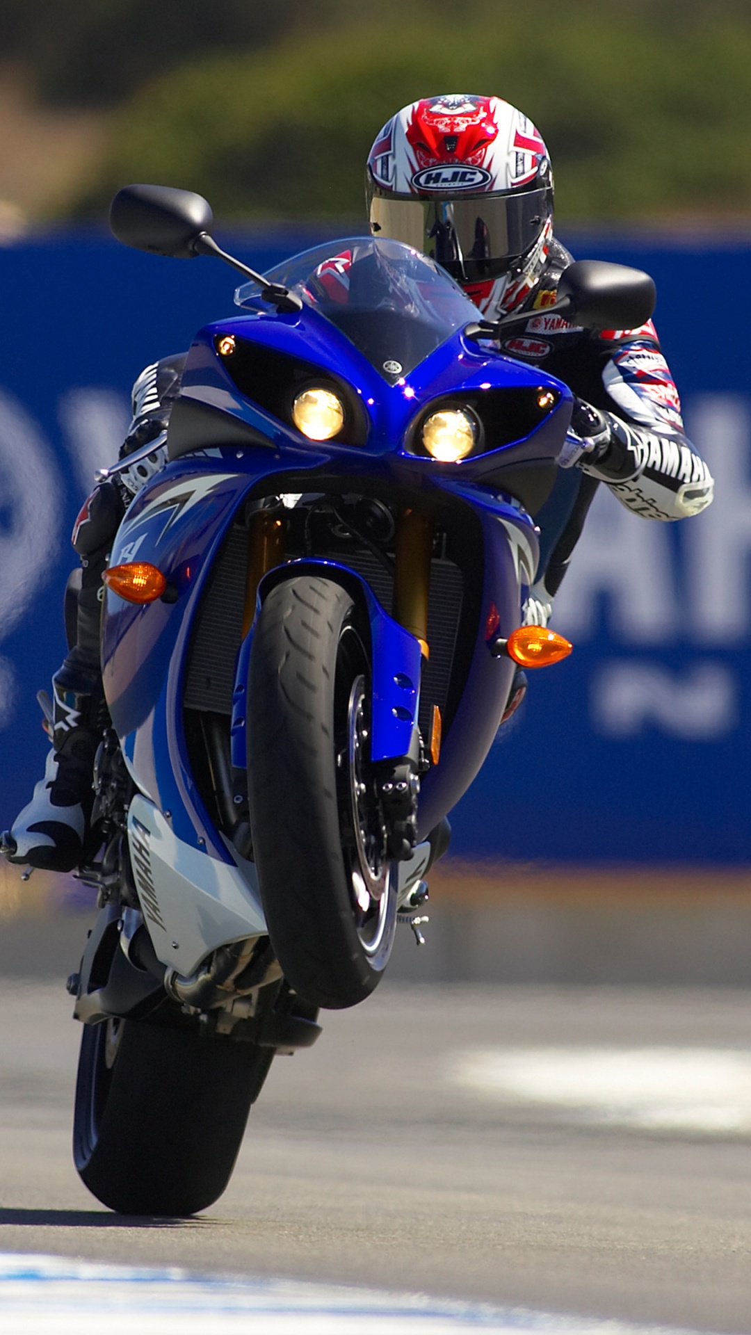 Man in Blue and Red Motorcycle Helmet Riding Blue and White Sports Bike. Wallpaper in 1080x1920 Resolution