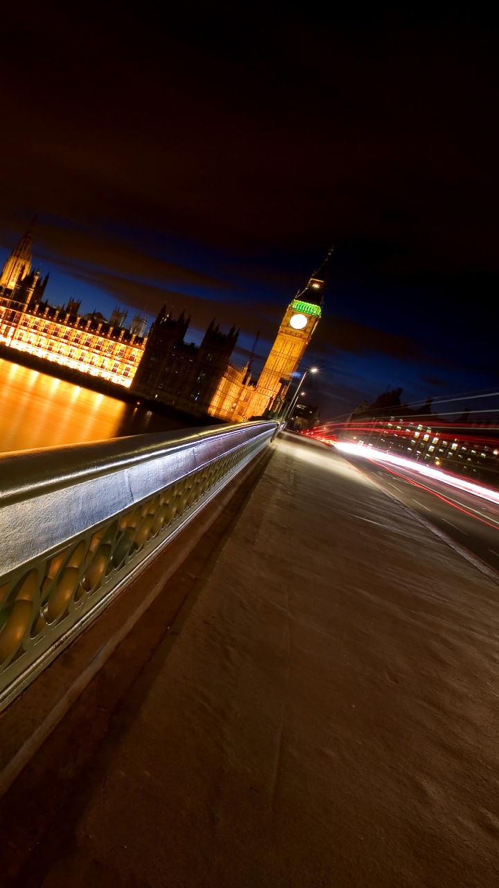 Lighted Bridge Over River During Night Time. Wallpaper in 720x1280 Resolution