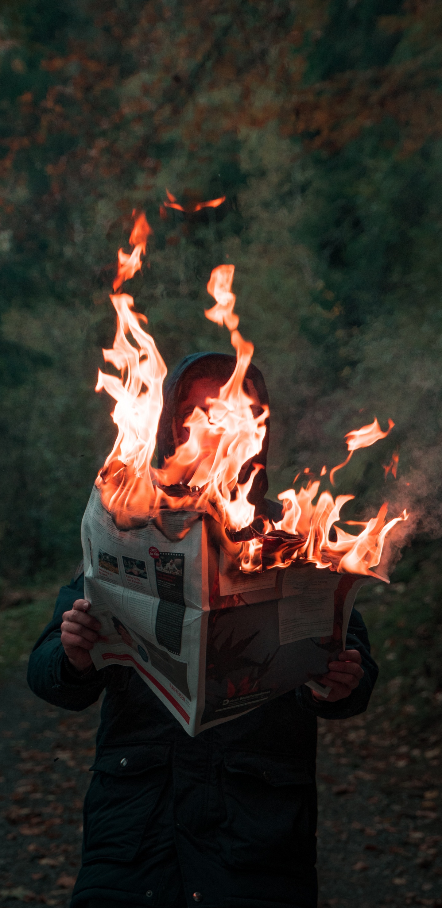 Person in Black Jacket Holding Fire. Wallpaper in 1440x2960 Resolution